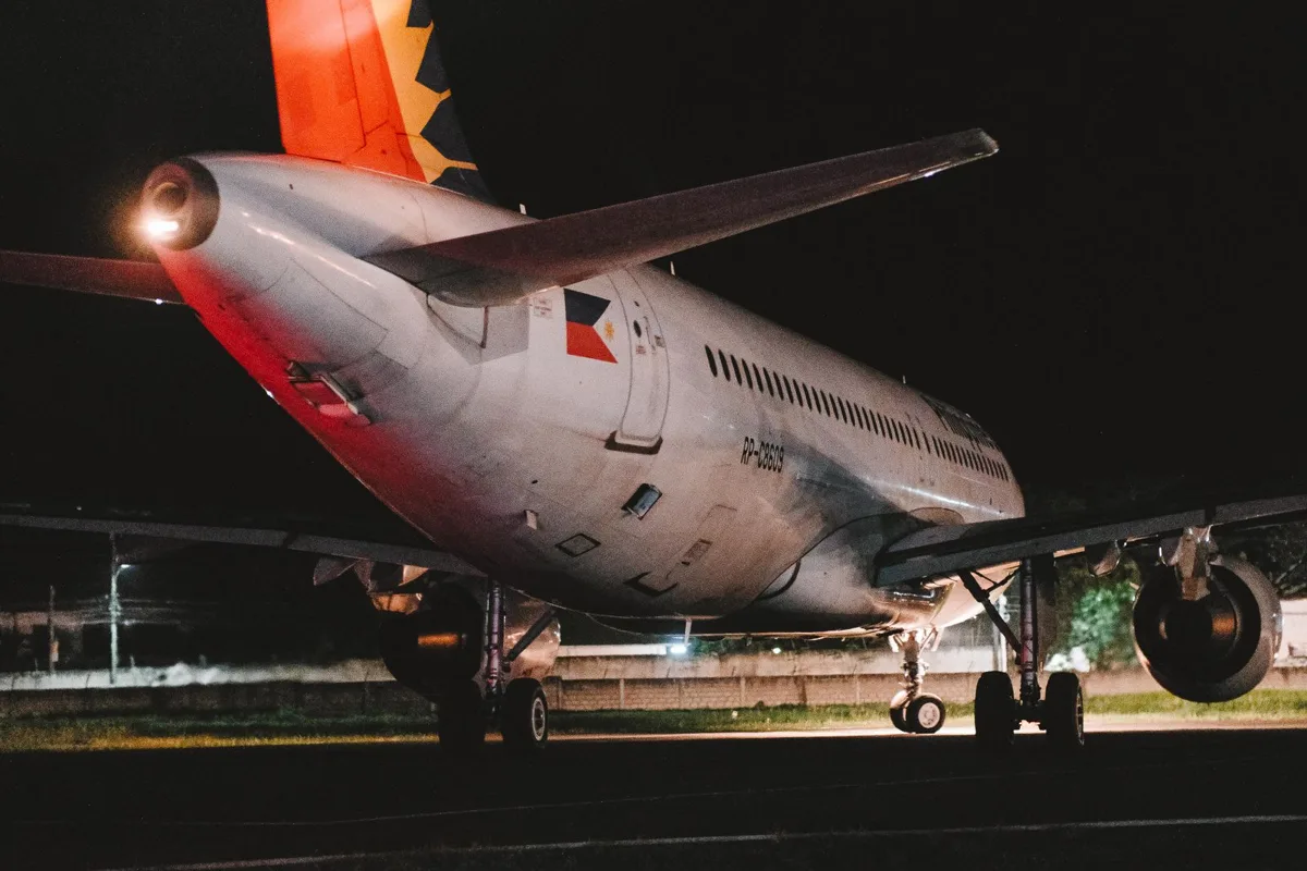 A passenger airliner parked on a tarmac at night (generic file photo, not in Saudi Arabia). This photo does not depict any event reported in this article.