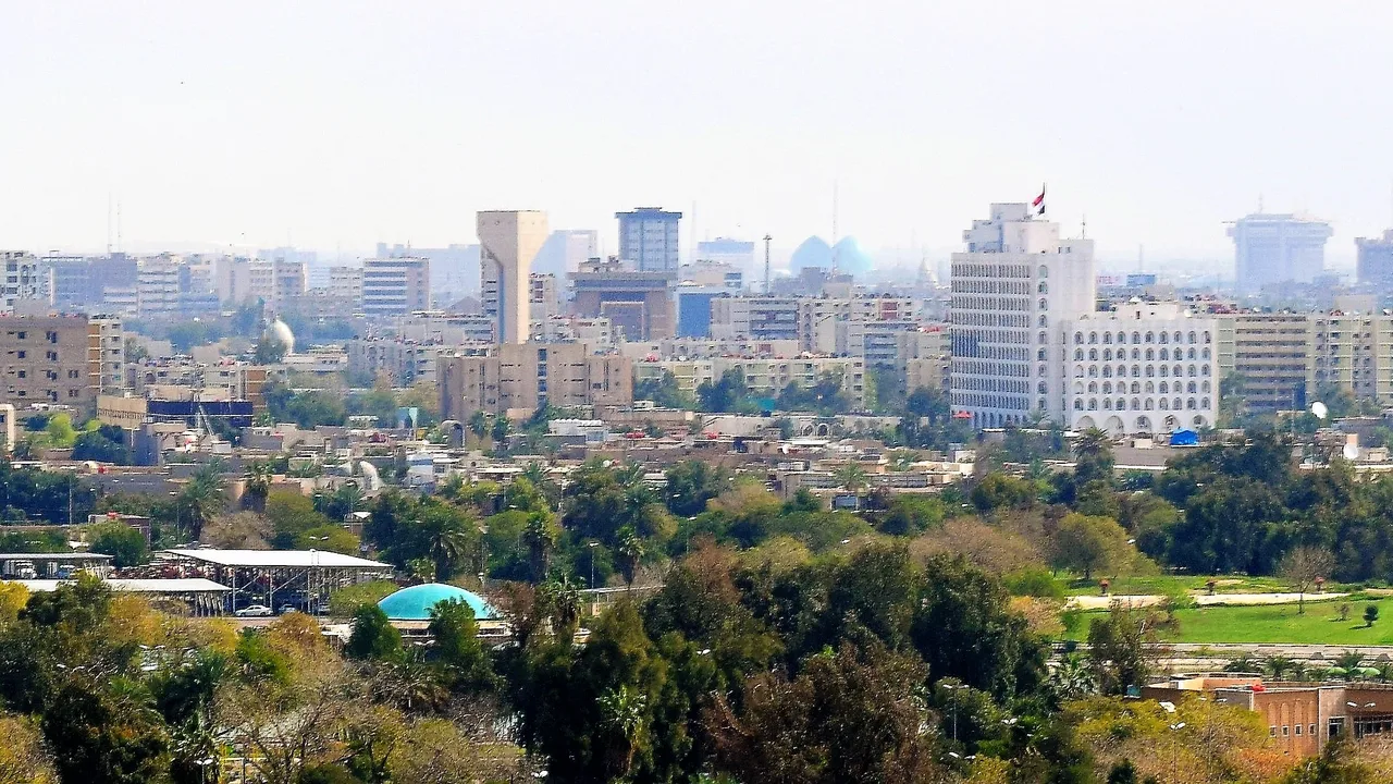 The Baghdad skyline seen across the city's parkland (file photo, 2017). Baghdad fell to US forces on 9 April 2003, three weeks into the invasion, and was the centre of the sectarian violence of 2006-07. This photo does not depict the war.