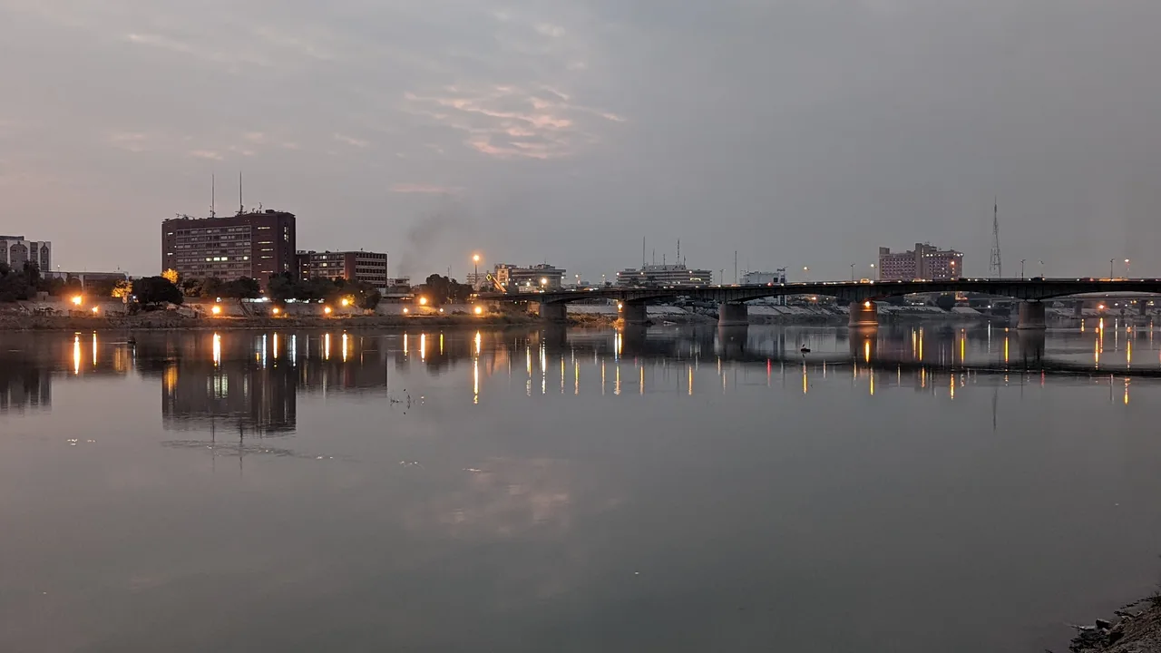 The Tigris at dusk in Baghdad, with one of the river's bridges lit against the evening sky (file photo). Coalition forces advanced up the Tigris-Euphrates valley in March 2003 and took the capital on 9 April; the river crossings were among the city's contested points in the years that followed. This photo does not depict the war.