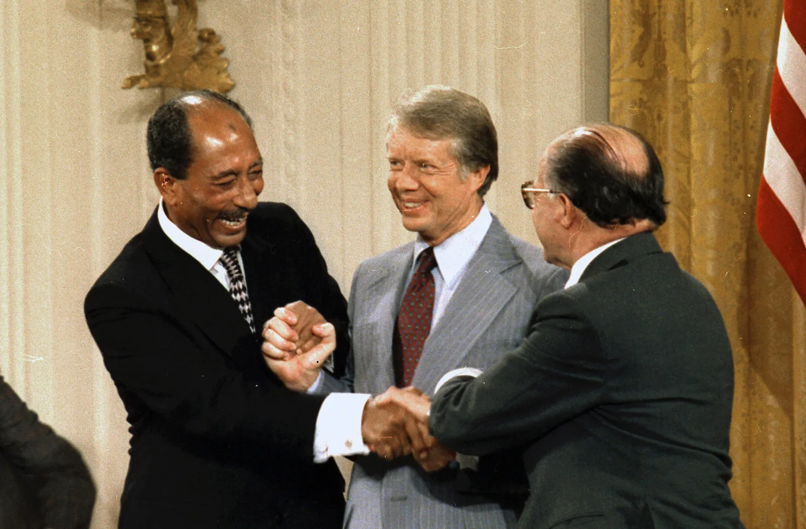 Anwar Sadat of Egypt, Jimmy Carter of the United States and Menachem Begin of Israel at the Camp David Accords signing ceremony in September 1978 — the diplomatic destination the 1973 war made possible, five years on. - U.S. National Archives, via Wikimedia Commons (public domain)