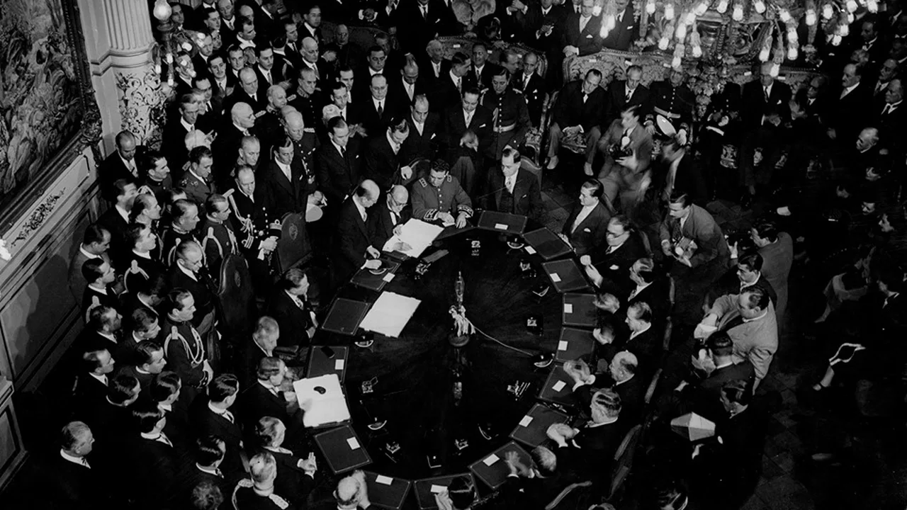 Delegates signing the Treaty of Peace, Friendship and Boundaries between Bolivia and Paraguay in Buenos Aires on 21 July 1938, seen from above around the conference table — the settlement that awarded most of the disputed Chaco Boreal to Paraguay, three years after the fighting stopped. Period photograph of the signing, not a depiction of the war.