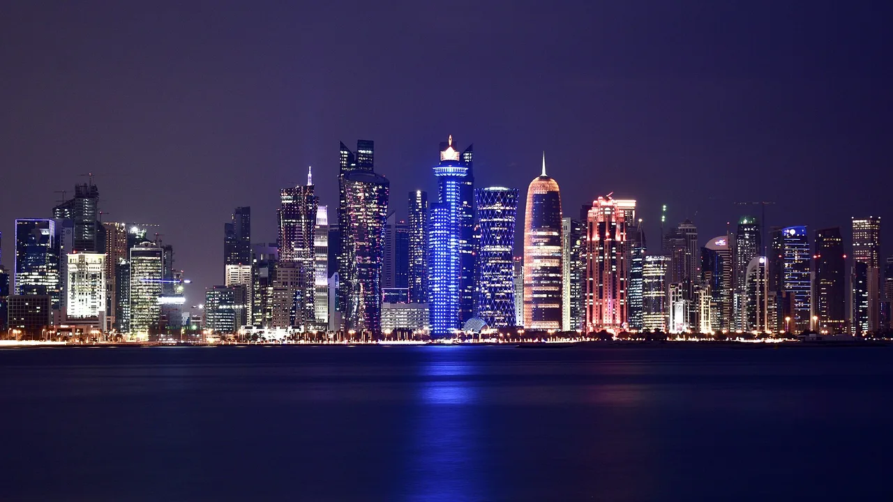 The West Bay skyline of Doha, Qatar, at night, seen from across the bay (file photo, January 2020). Qatari mediators presented the draft in Tehran on Sunday. This photo does not depict any event reported in this article.