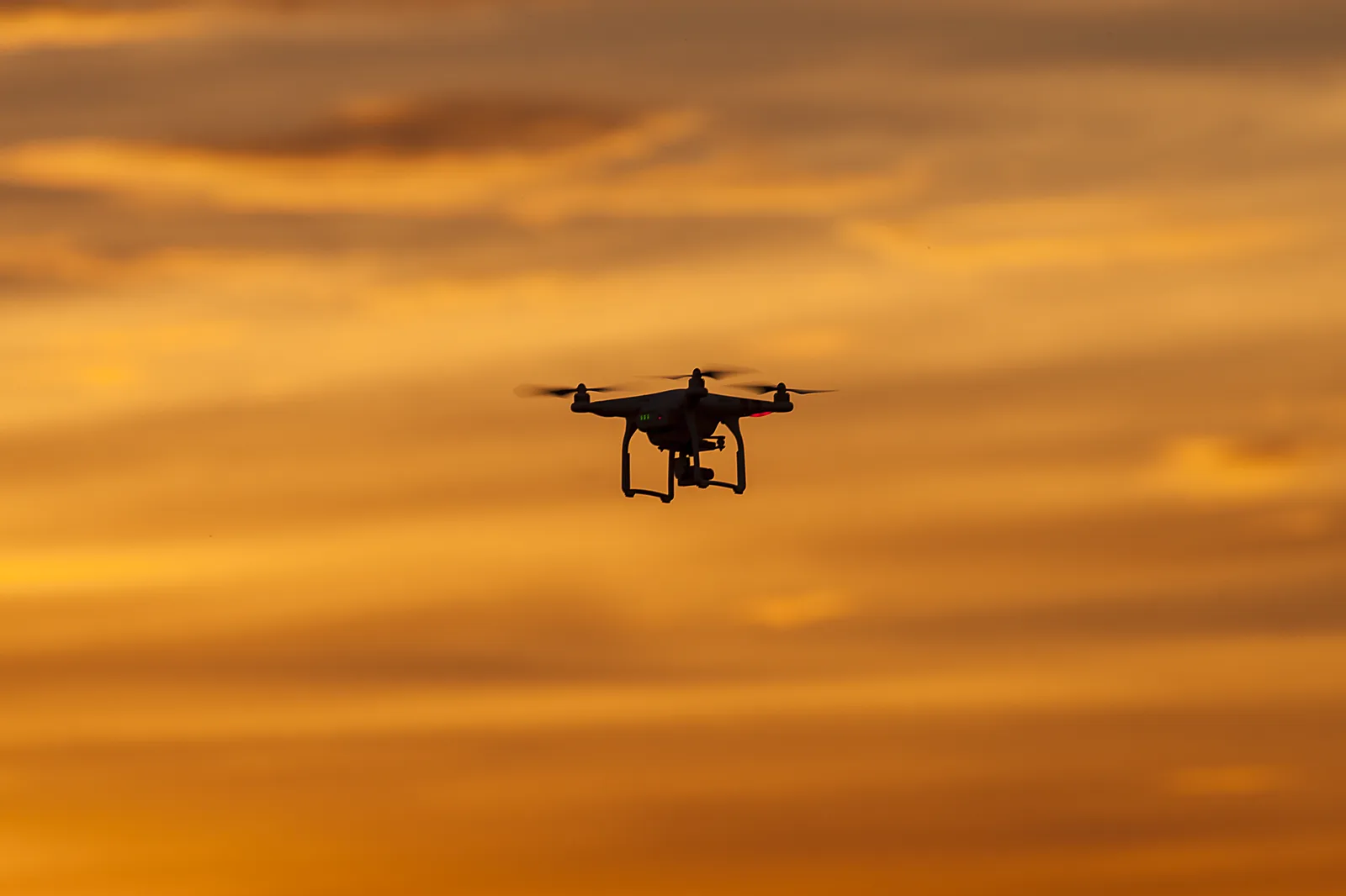 A drone silhouetted against the sunset. — Photo: Greg Clarke / Wikimedia Commons (CC BY 2.0)