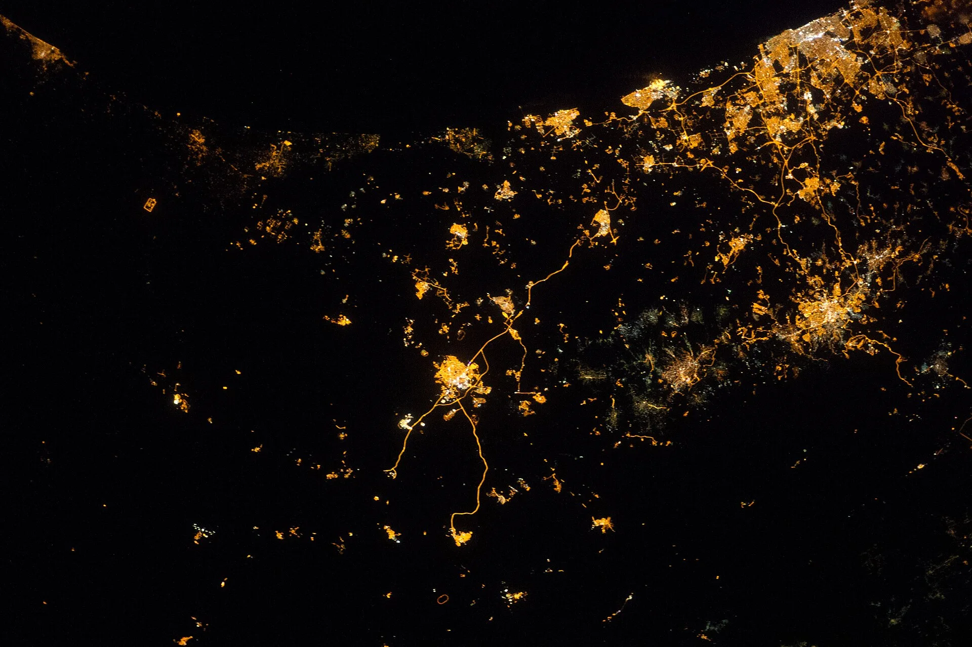 Israel and Gaza at night, photographed from the International Space Station (file photo, 2014). The Yellow Line divides the Gaza Strip lengthwise between Israeli-held and Palestinian areas. This photo predates the line and does not depict it.