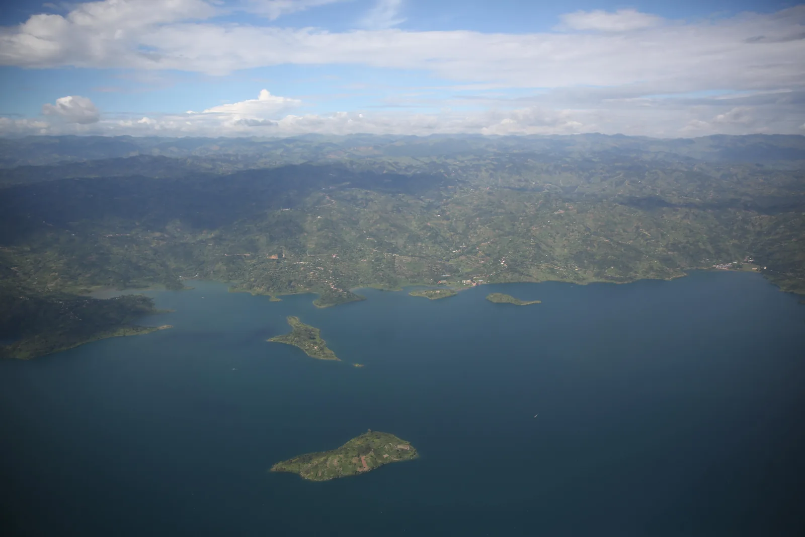 Lake Kivu and its forested shoreline, seen from above.