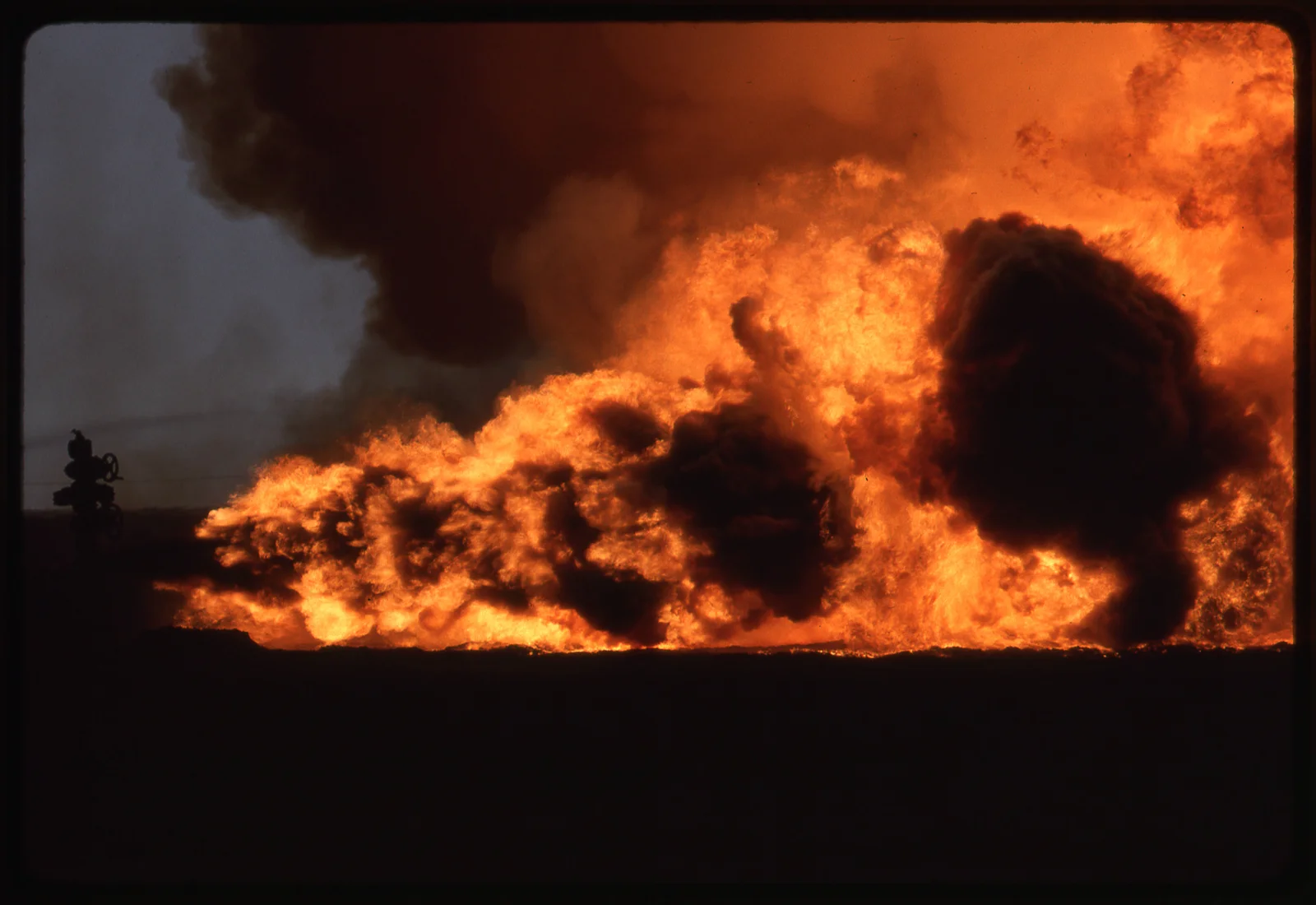 A Kuwaiti oil well ablaze, 1991 (U.S. Army Corps of Engineers photo). Retreating Iraqi troops set fire to more than 700 of Kuwait's oil wells — one of the worst environmental disasters of the 20th century.