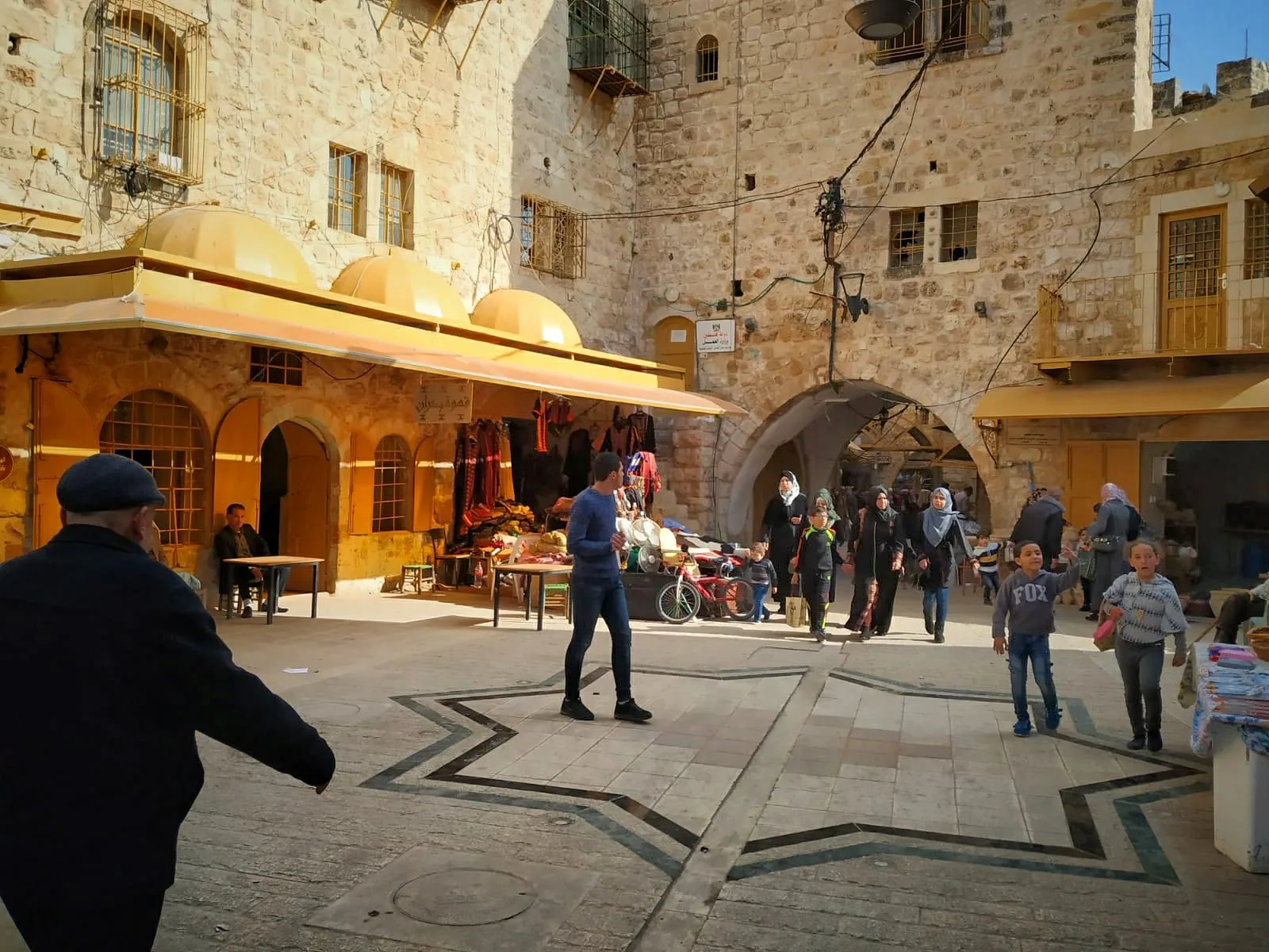 A market square in the Old City of Hebron, in the occupied West Bank (file photo). Across the West Bank, five Palestinians were killed and more than 240 injured by Israeli forces or settlers in the past two weeks, OCHA reported. This photo does not depict any event reported in this article.