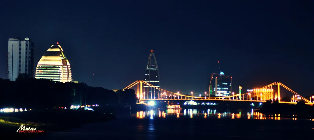 Khartoum's skyline at night, with a lit bridge over the Nile.