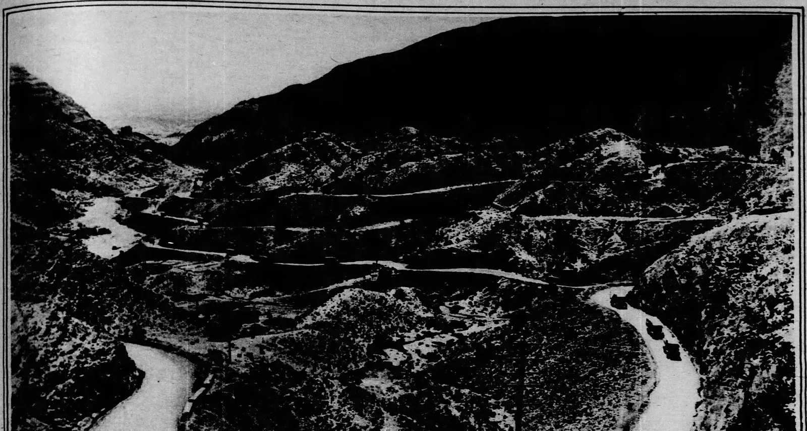 The Khyber Pass in an archive photograph by Ewing Galloway, showing the motor road and camel path winding through the cliffs (archive photo). This photo does not depict the Kurram sector or any event reported in this article.