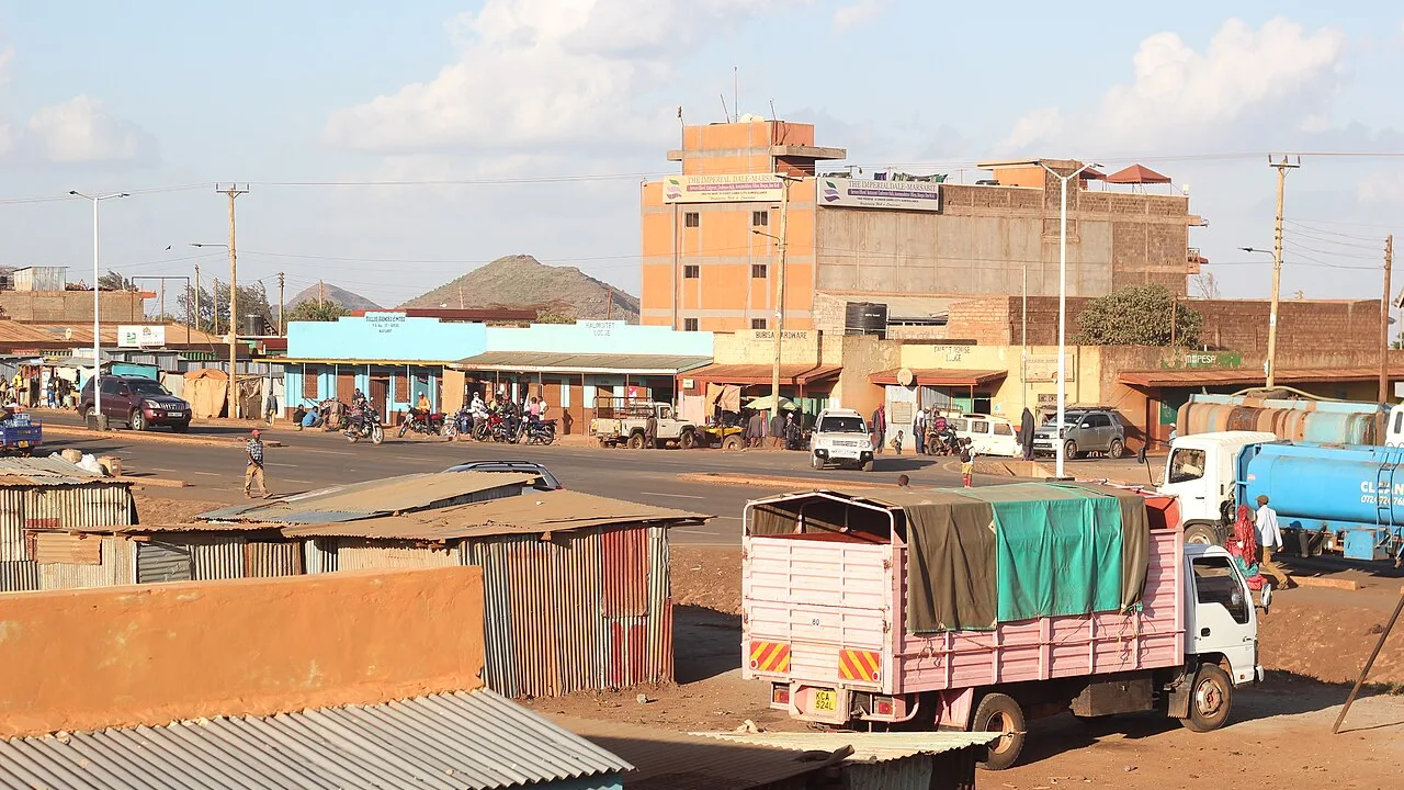 A street scene in Marsabit town, northern Kenya, with shops, trucks and motorbikes (file photo). Marsabit County, whose commissioner gave the first crossing figures, administers the Kenyan side of the border area receiving people fleeing Moyale. This photo does not depict any event reported in this article.