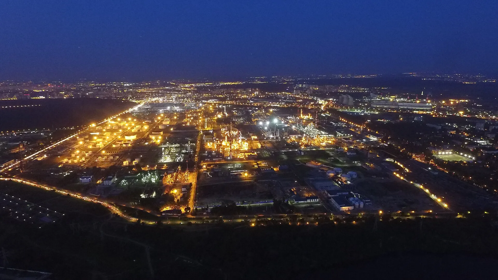 A Russian oil refinery lit up at night (file photo — the Moscow refinery, not the plant reported struck). Ukraine struck Rosneft's Novokuibyshevsk refinery in Samara region early on Friday, the Wall Street Journal reported. This photo does not depict any event reported in this article.