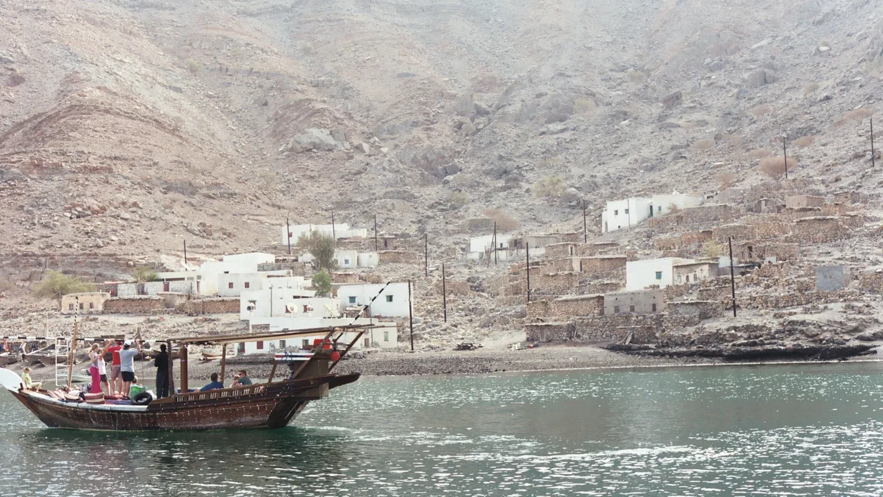 A dhow off a coastal village in Oman's Musandam Peninsula, on the southern shore of the Strait of Hormuz (file photo). Maritime security sources say targeting has widened beyond the strait in recent days. This photo does not depict any event reported in this article.