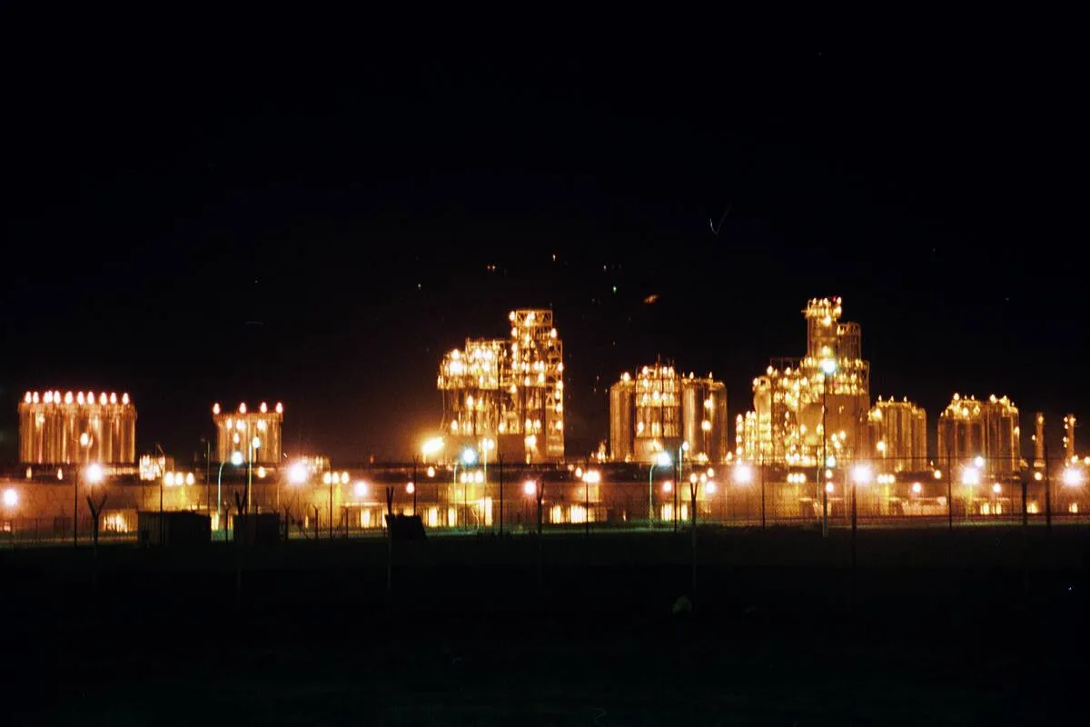 The Mina Al-Ahmadi oil refinery in Kuwait at night. Archive photo — it does not depict any strikes in Russia described in this article.