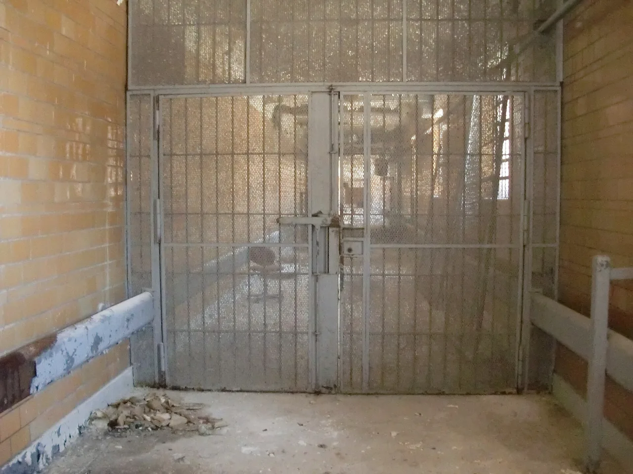 A barred gate in a prison corridor (file photo). The prisoners described in this article are held in Israeli prisons and military detention facilities; this photo does not depict any facility named in it.