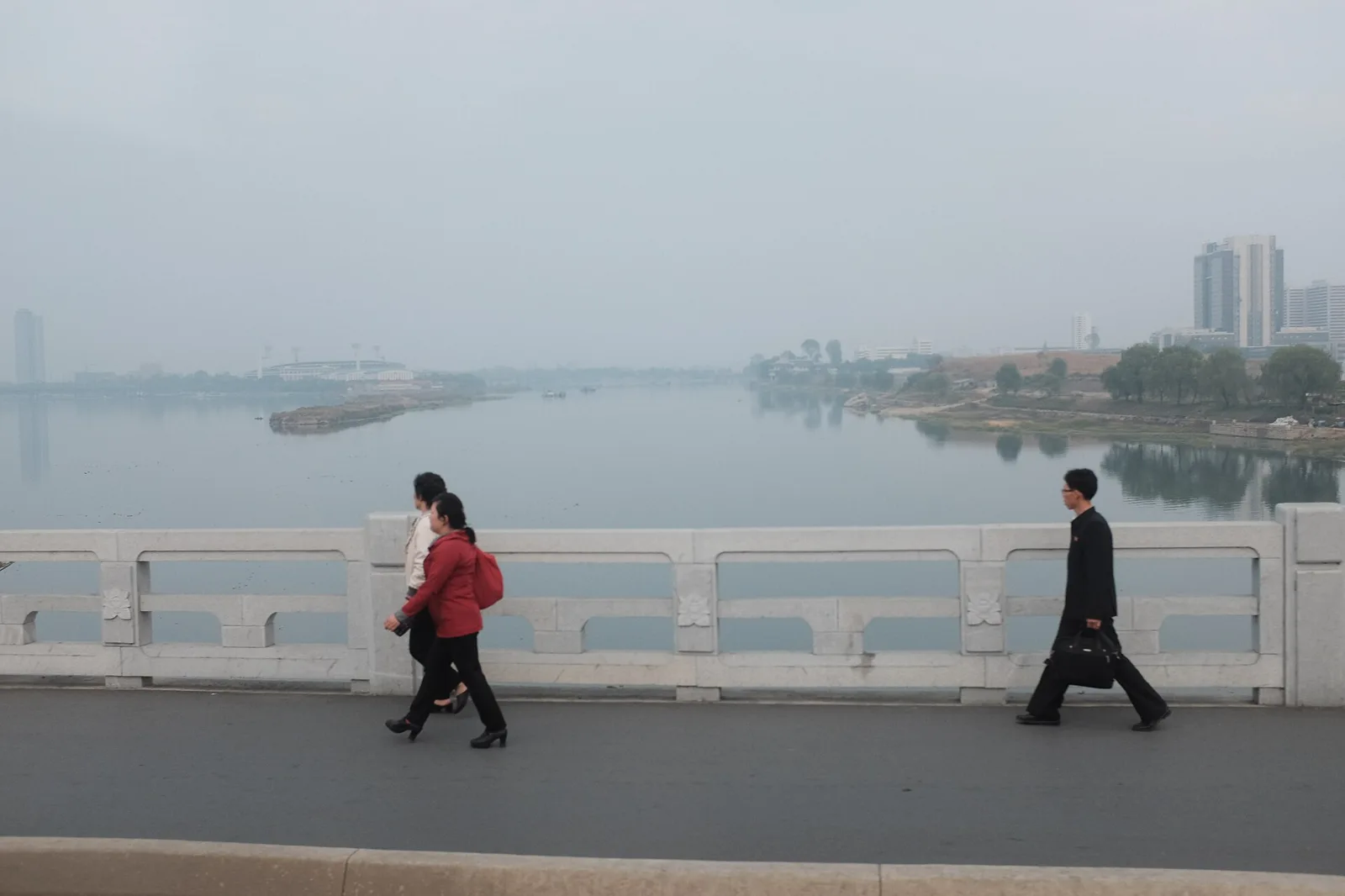 Pedestrians cross a bridge over the Taedong River in Pyongyang, North Korea (file photo). Monday's statement was issued in the capital through state media KCNA. This photo does not depict any event reported in this article.
