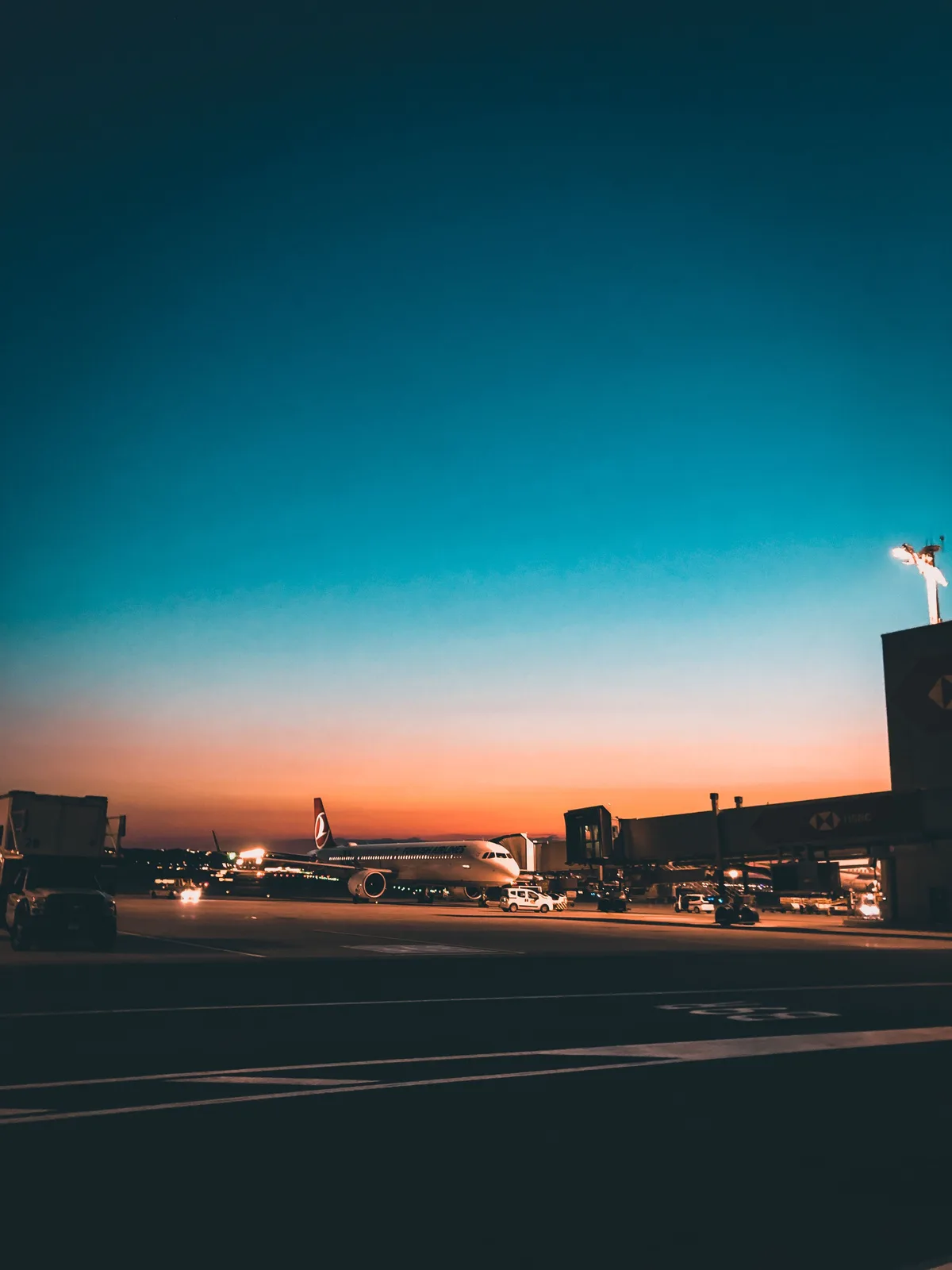 A passenger jet on the tarmac at an airport terminal at dusk (file photo). This photo does not depict the reported strike.