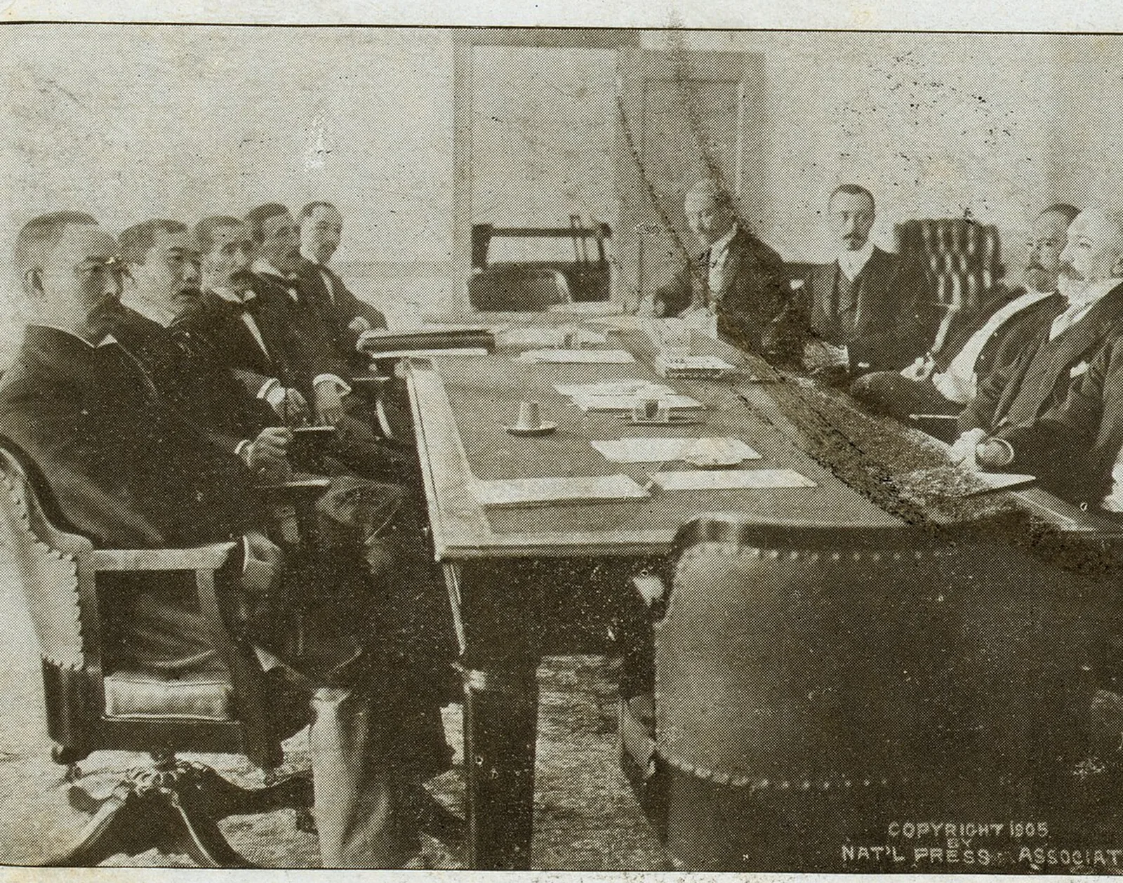 The Russian and Japanese peace envoys in session at the Portsmouth Navy Yard, 1905 (detail of a period postcard photograph).