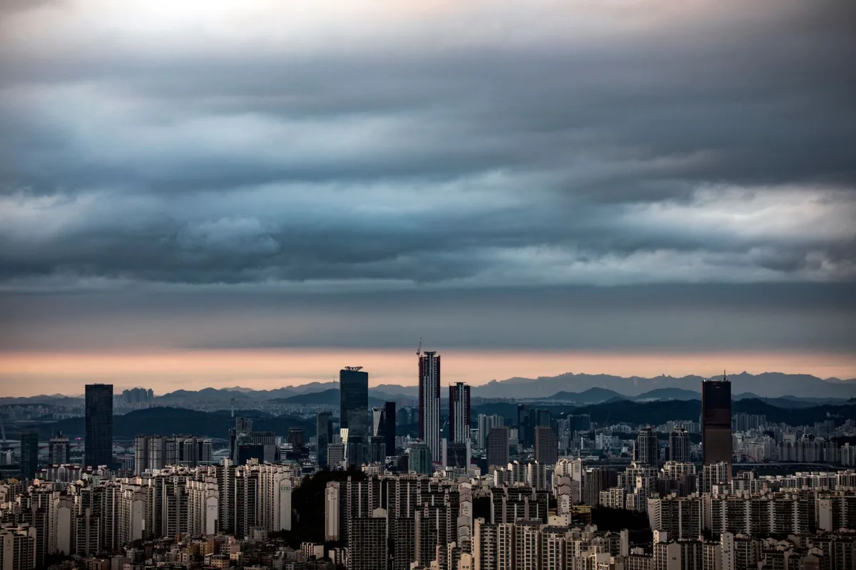 Seoul's skyline under cloud at twilight (file photo). This photo does not depict any event reported in this article.