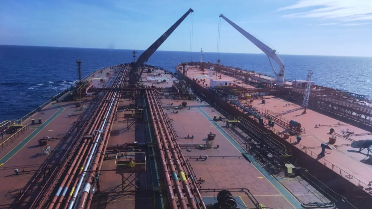 The decks of two large tankers side by side during a ship-to-ship transfer operation at sea (file photo). The vessel attacked on Thursday was identified by Vanguard Tech as a suezmax-size tanker of about 159,000 dwt. This photo does not depict any vessel or event reported in this article.
