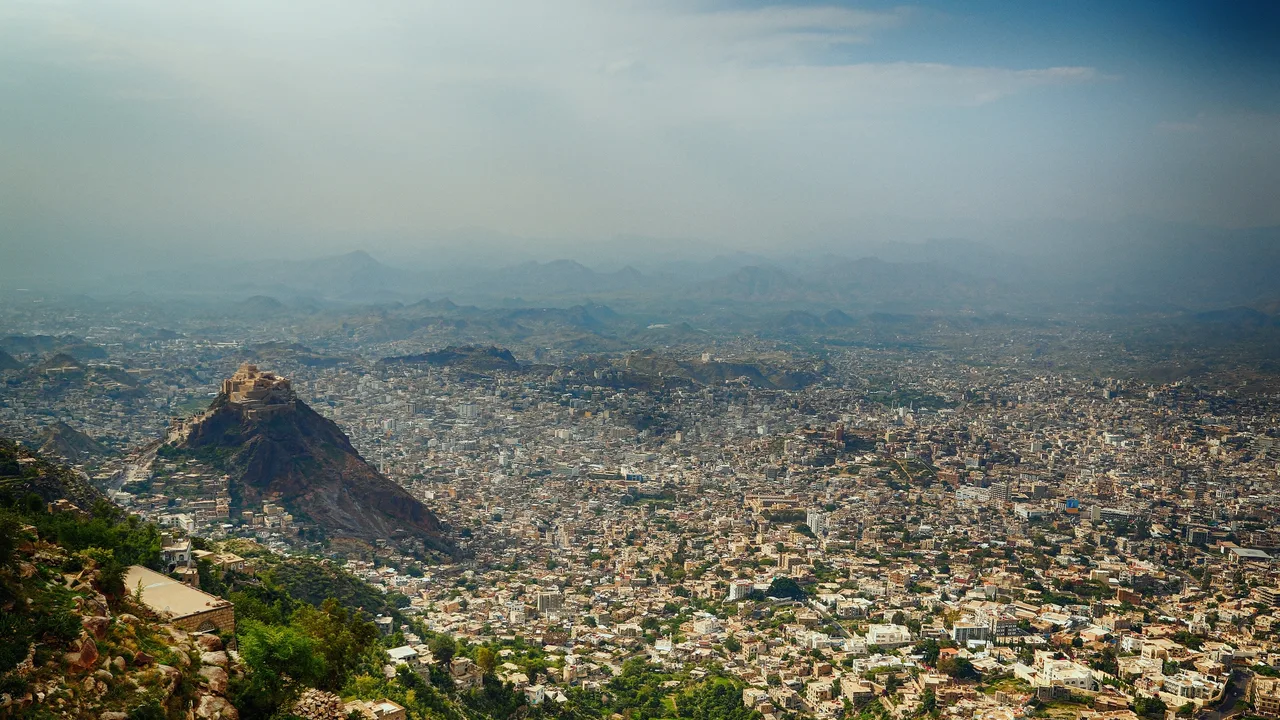 The hillside districts of Taiz, Yemen's third-largest city (file photo). Houthi forces have surrounded Taiz since 2015 and fully encircled it in October 2026, UN agencies and Human Rights Watch say. This photo does not depict any event reported in this article.