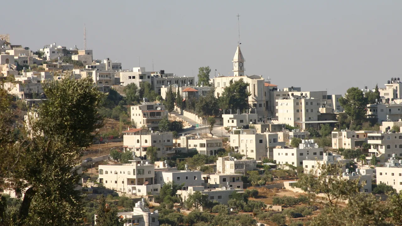 The Palestinian village of Taybeh in the occupied West Bank, with its church tower (file photo, 2010). This photo does not depict the events reported in this article.