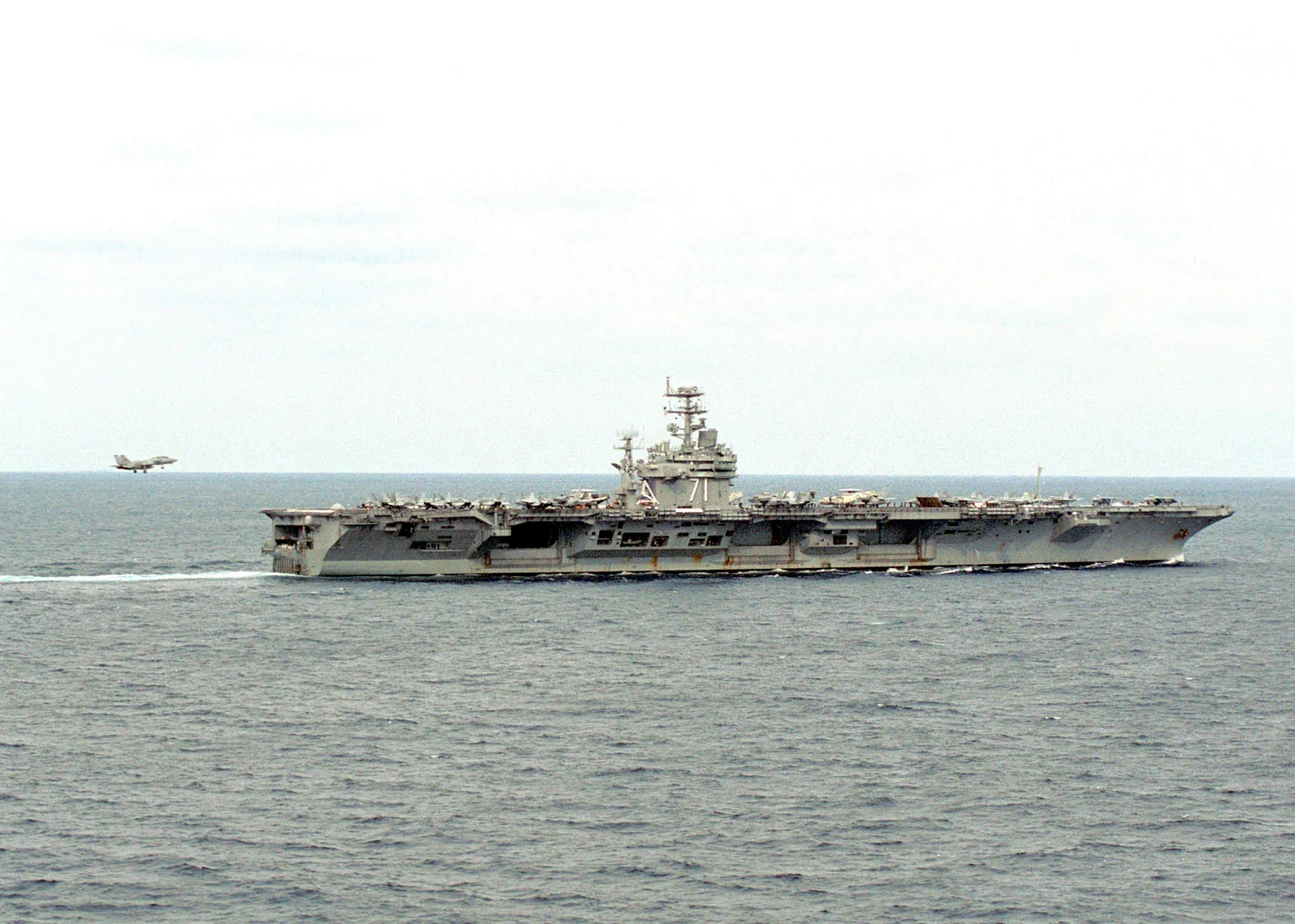 The aircraft carrier USS Theodore Roosevelt (CVN 71) at sea in an earlier file photo. Generic U.S. Navy photo — it does not depict the current deployment.