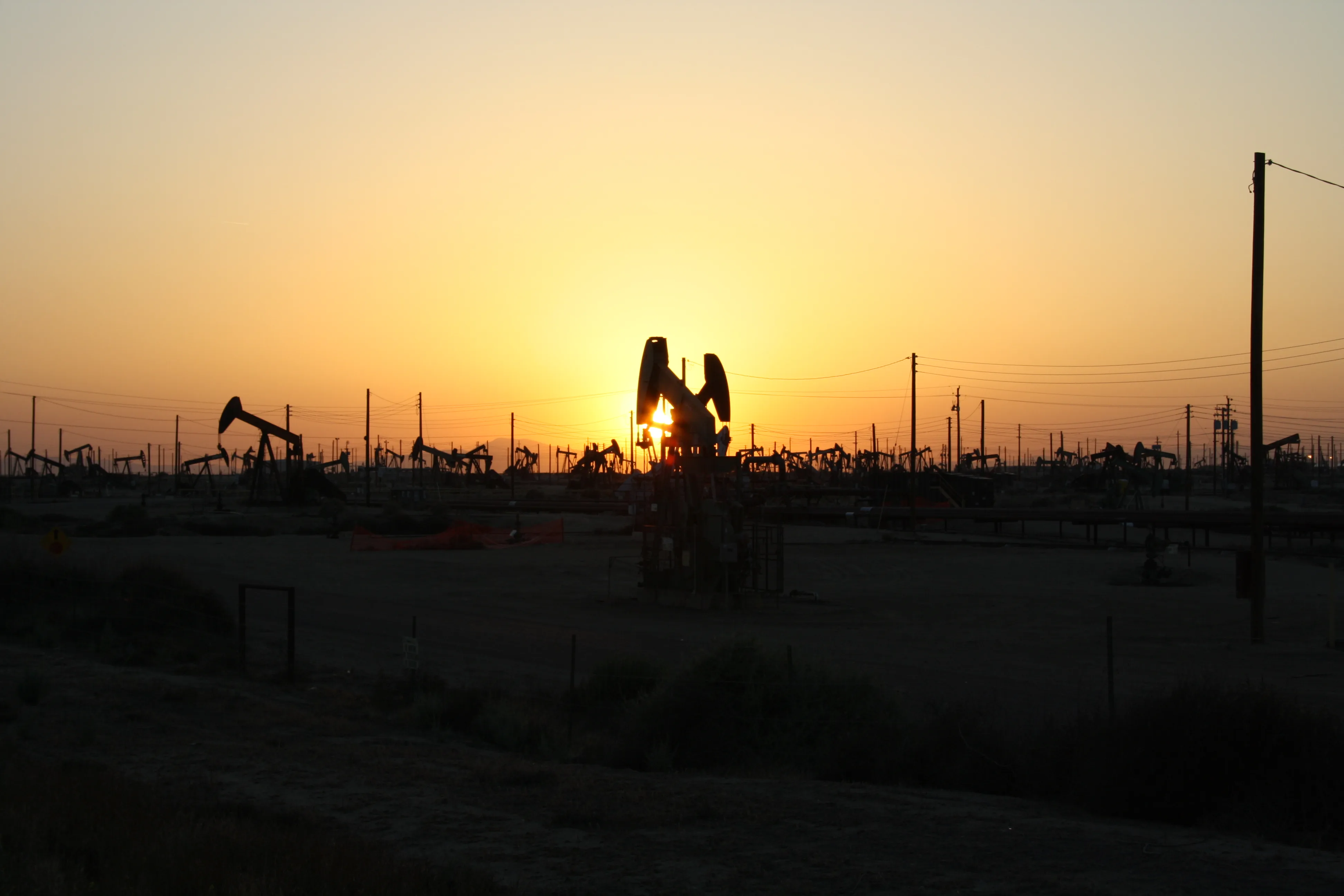 Oil pumpjacks silhouetted at sunset in California. File photo — it does not depict any event described in this article.