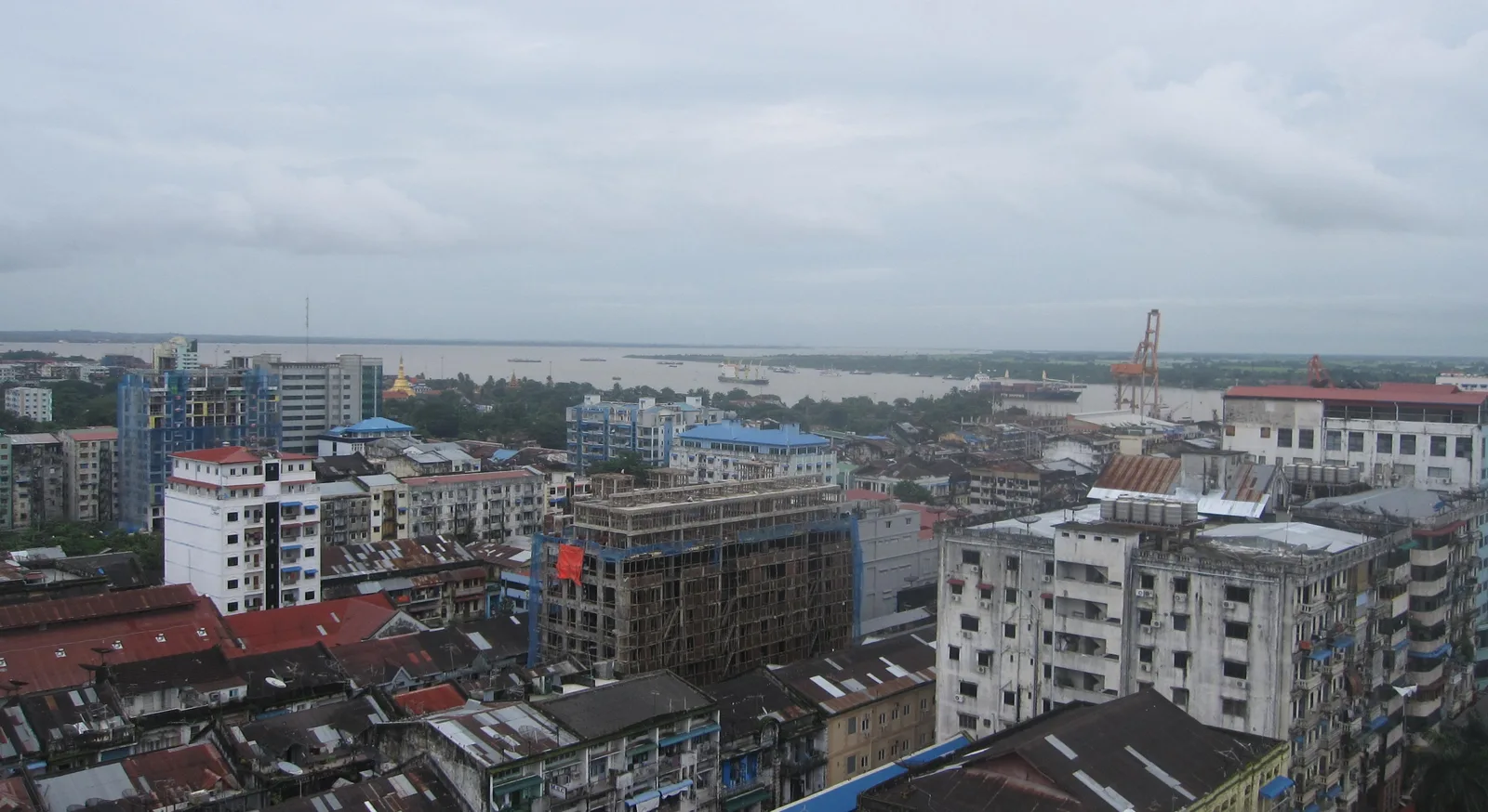 Yangon's skyline, with the river and port beyond.